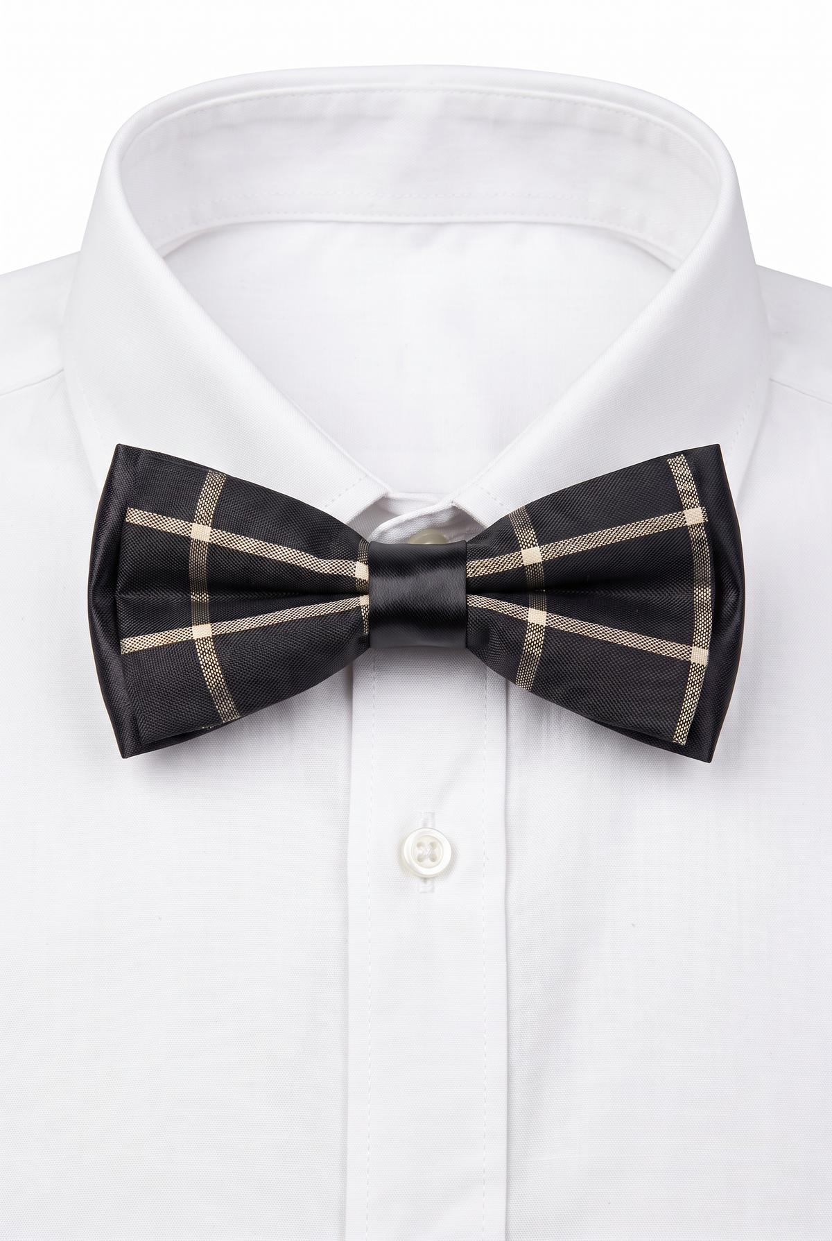 Boys checkered pre-tied bow tie worn with a white formal shirt in black and gold