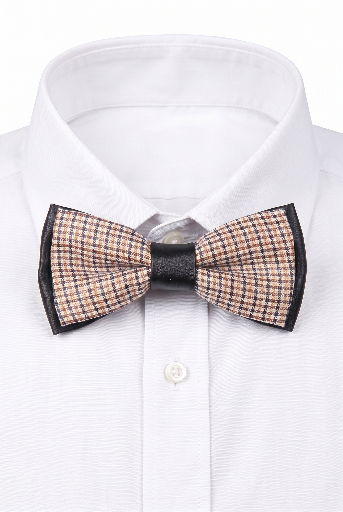 Boys checkered pre-tied bow tie worn with a white formal shirt in black and orange