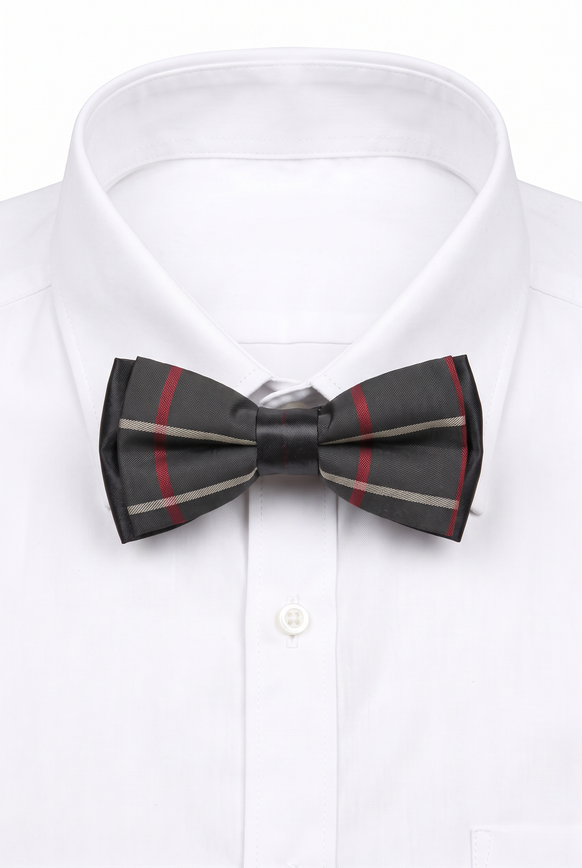 Boys checkered pre-tied bow tie worn with a white formal shirt in black and red