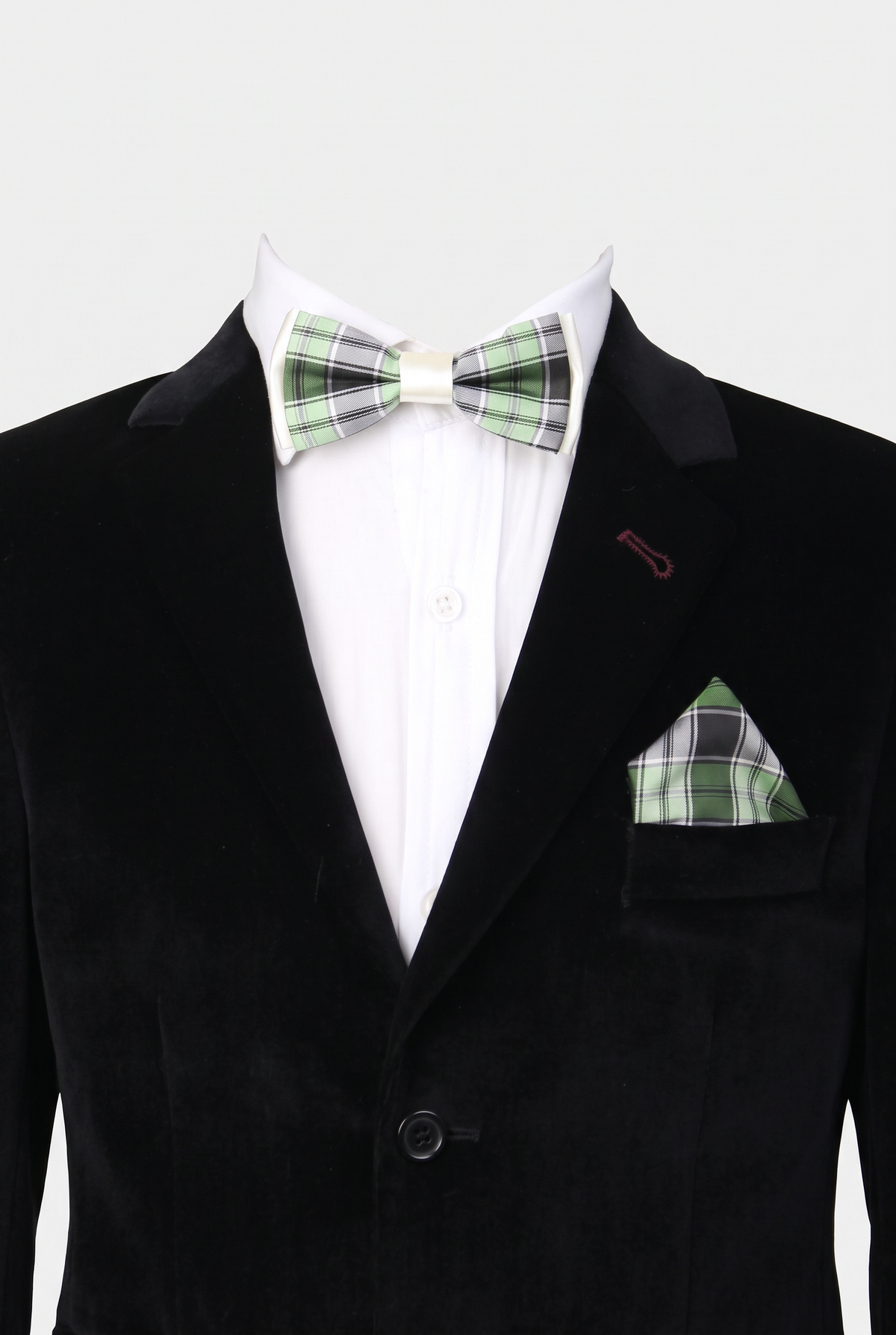 Boys checkered bow tie and matching pocket square styled with a formal suit in green and black