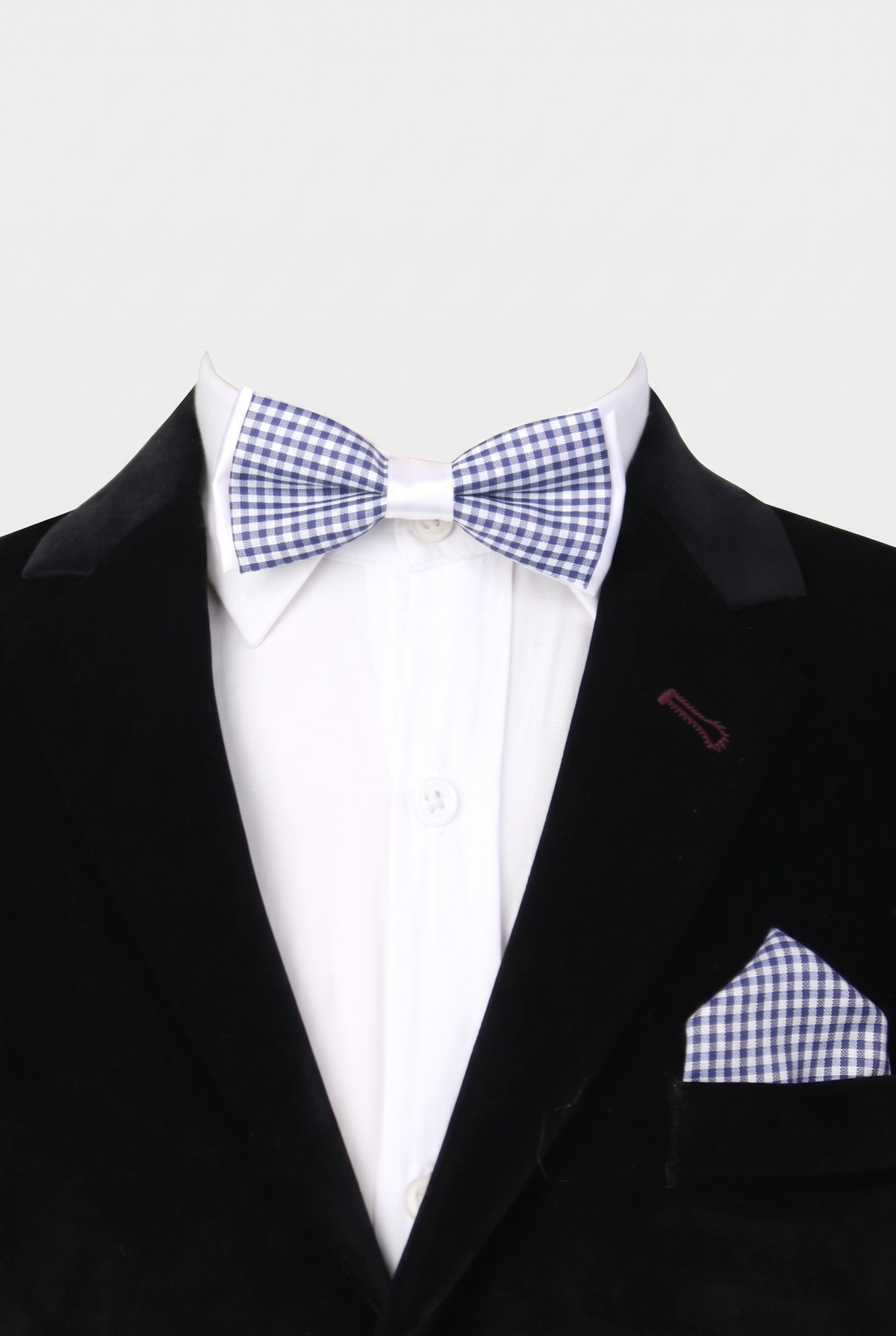 Boys checkered bow tie and matching pocket square styled with a formal suit in navy and white