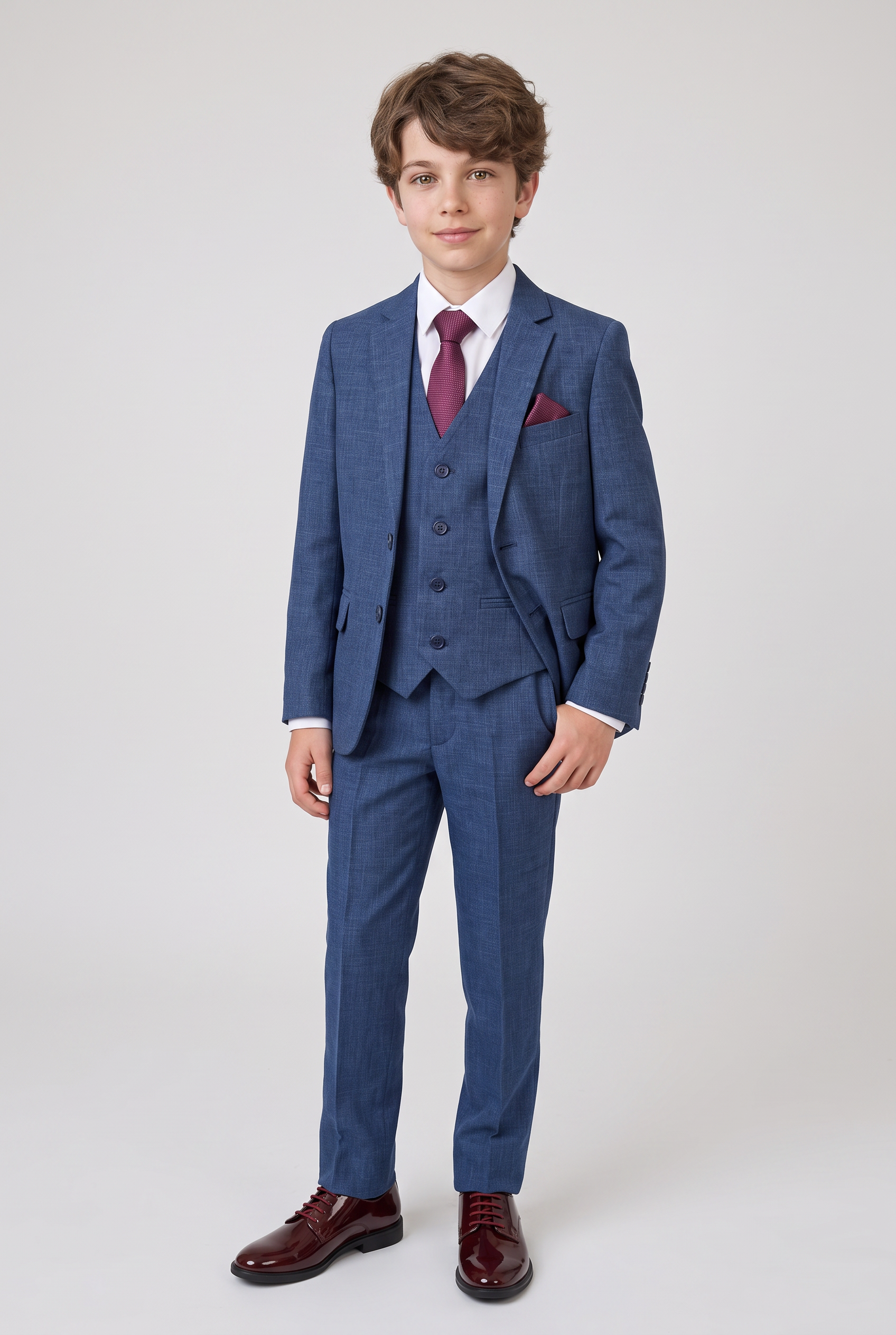 Full-length boy wearing navy three-piece formal suit