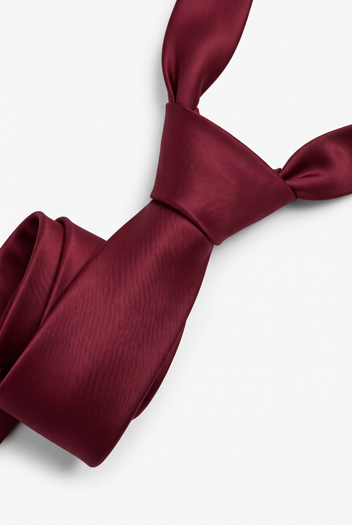 Burgundy satin necktie showing knot and fabric texture close-up