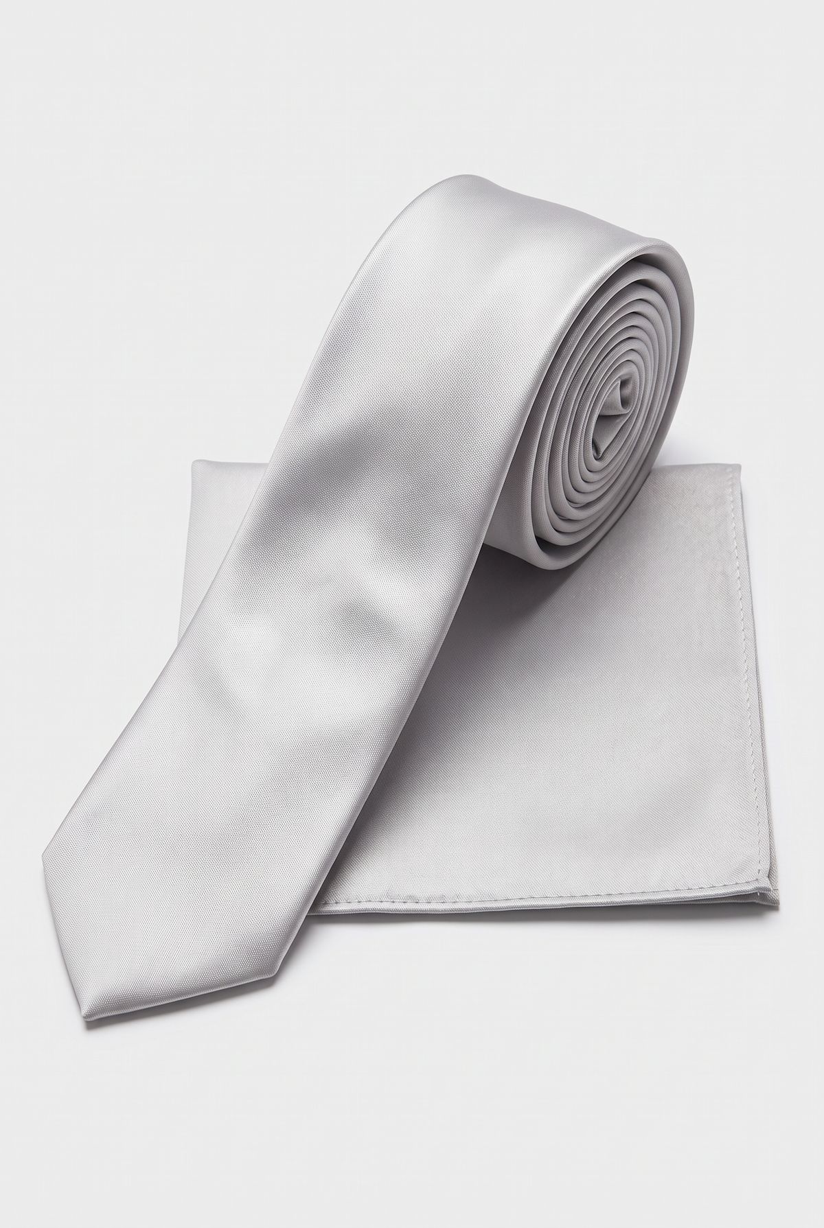 Silver satin tie and matching pocket square set, rolled view