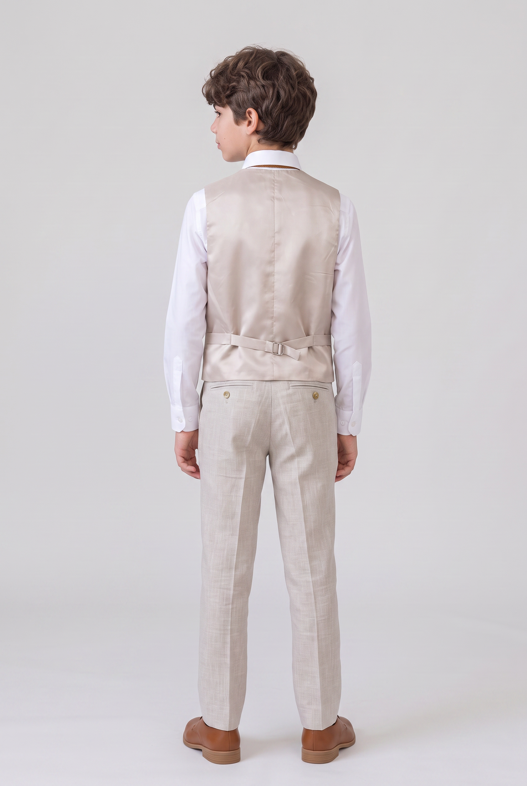 Back view of beige suit vest and trousers for boys