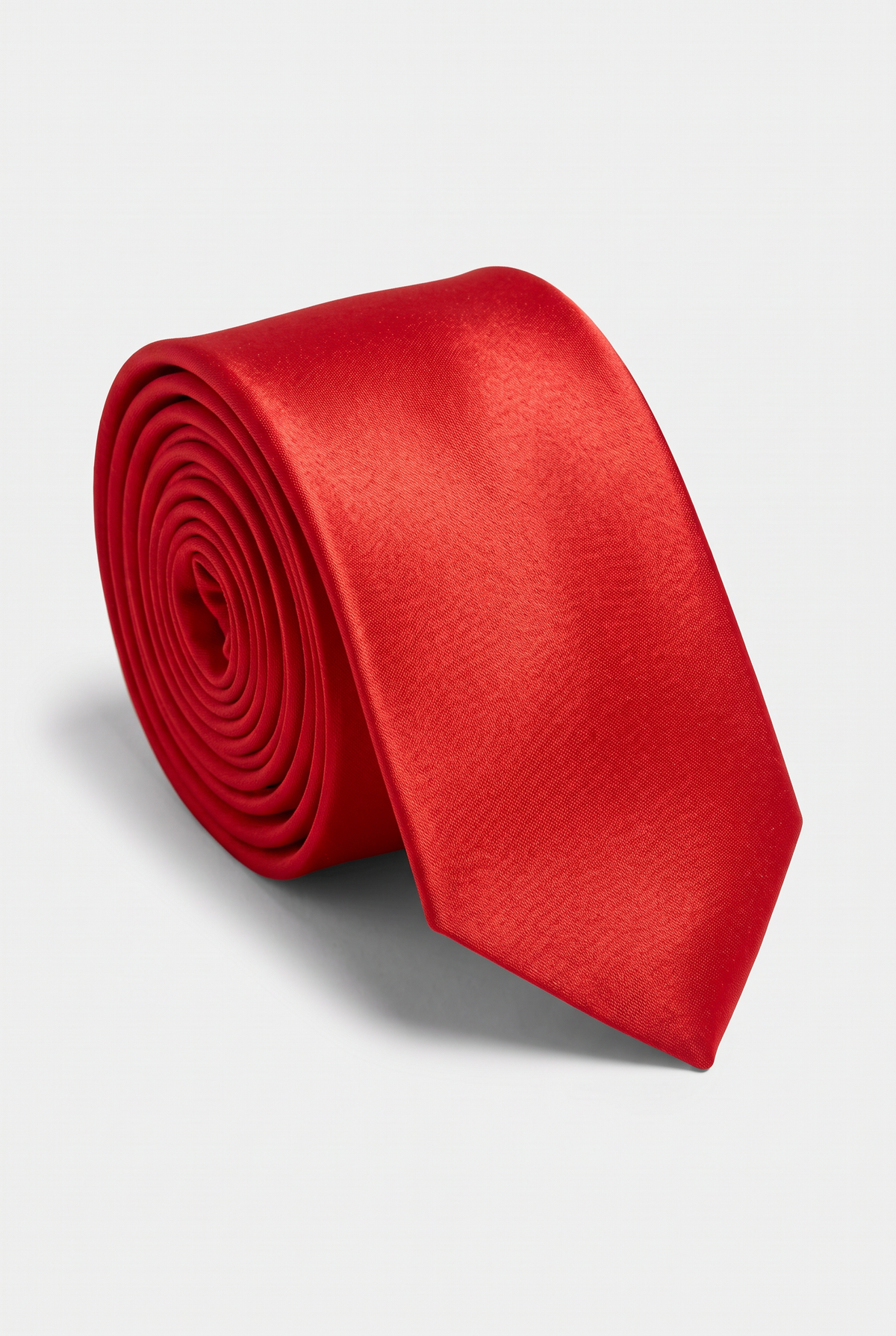 Red satin men's necktie, rolled close-up view 