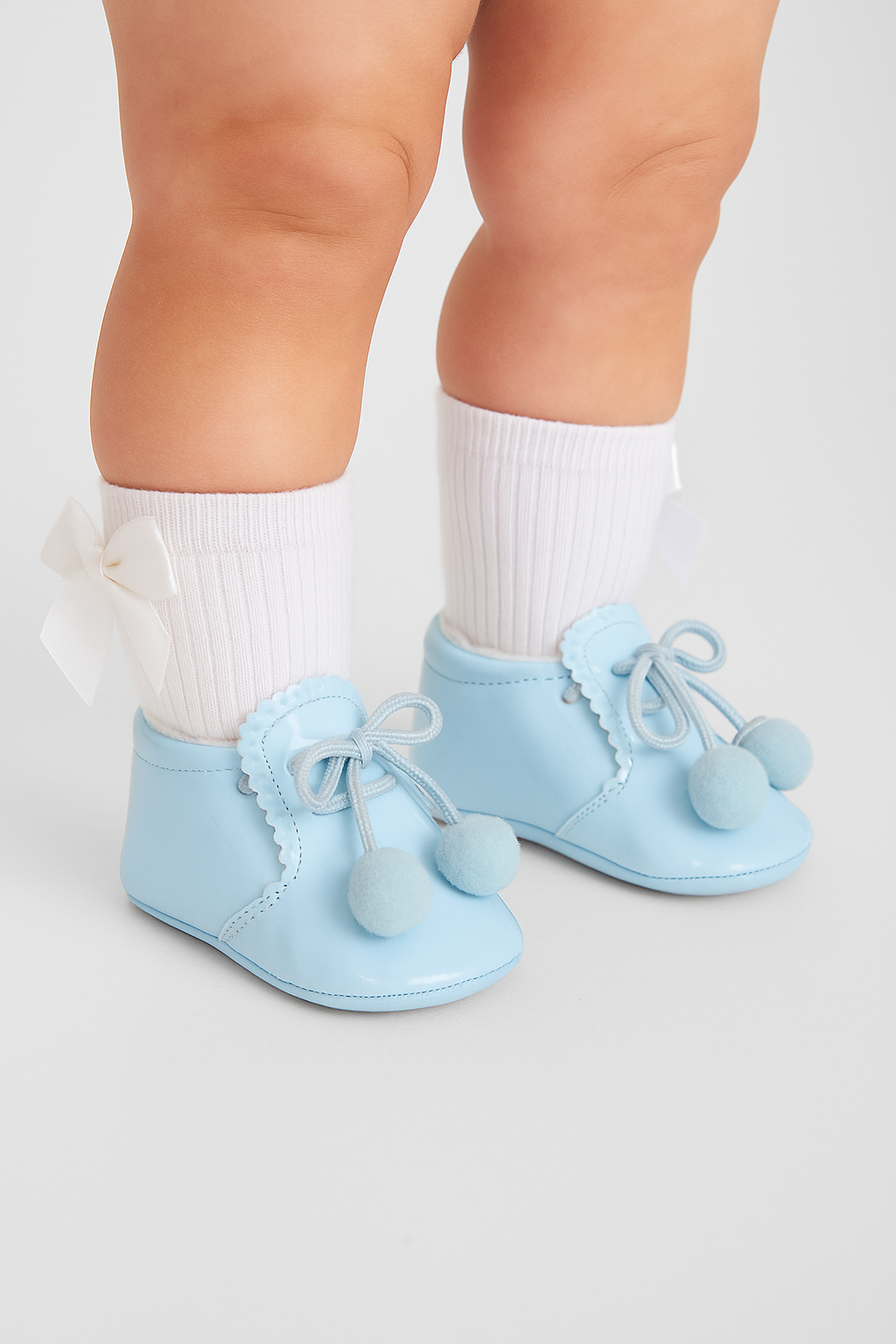 Unisex Baby Patent Pom Pom Booties Pram Shoes - Joe - Baby Blue Model Picture